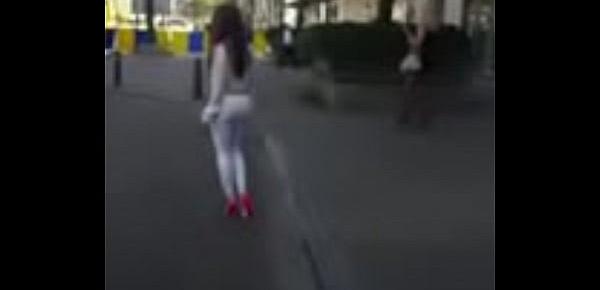  7321620 hooker walking in the street in sexy high heels and legging